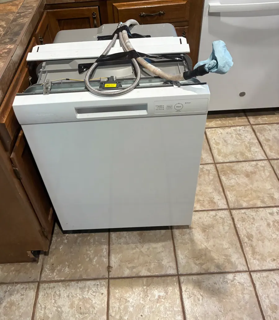 A dishwasher on a tile floor, one of the jobs All Star posted on Facebook